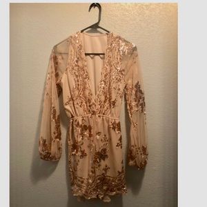 Beautiful low cut gold romper with sequin details